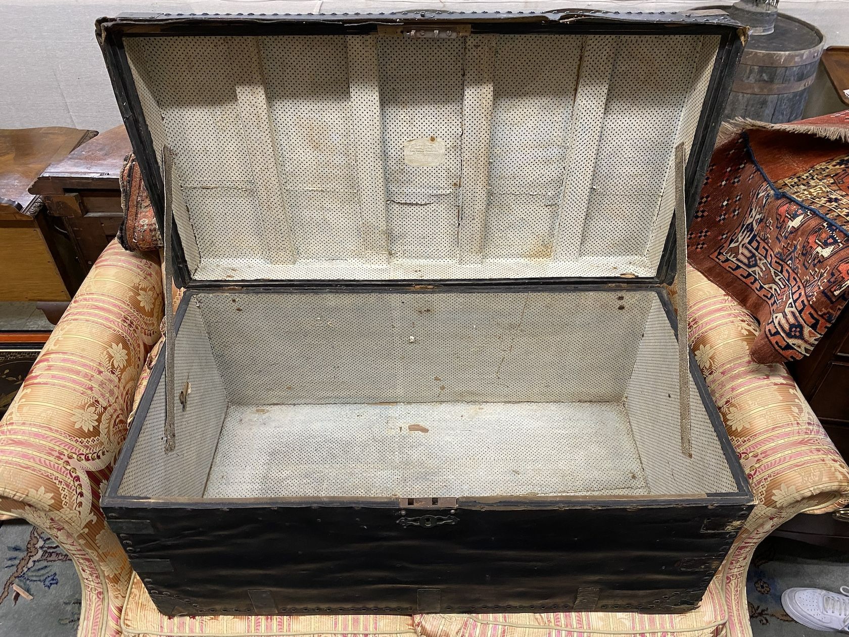 A Victorian studded black leather trunk, brass plaque inscribed Mr J Evans No. 2, width 107cm, depth 55cm, height 52cm